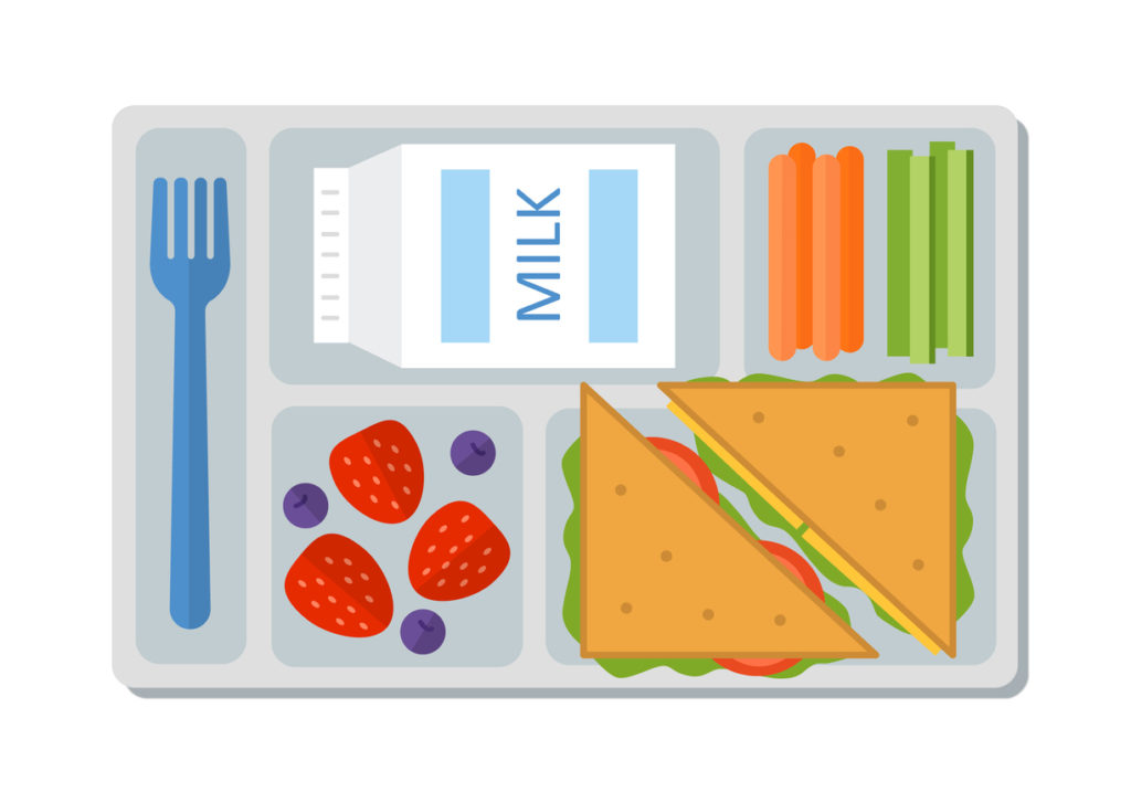 milk, carrot and celery sticks, sandwich and berries on a tray