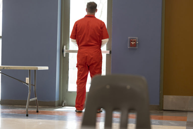 A prisoner wearing jail clothing